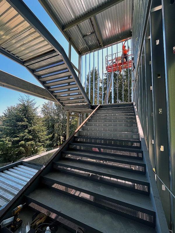 steel stair frames on the outside of a building under construction